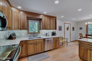 Meticulously maintained log-sided lakefront on TinkWig Lake with on Woodloch Springs Country Club in Pennsylvania - for sale on GolfHomes.com, golf home, golf lot