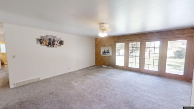 Welcome to this beautifully maintained Single-level home nestled on Paradise Valley Country Club in Wyoming - for sale on GolfHomes.com, golf home, golf lot