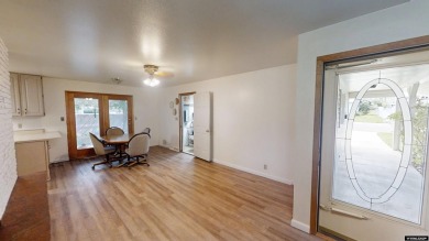 Welcome to this beautifully maintained Single-level home nestled on Paradise Valley Country Club in Wyoming - for sale on GolfHomes.com, golf home, golf lot