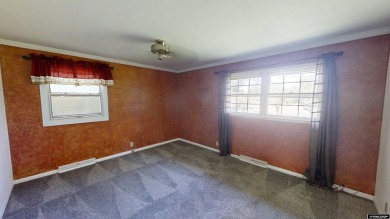 Welcome to this beautifully maintained Single-level home nestled on Paradise Valley Country Club in Wyoming - for sale on GolfHomes.com, golf home, golf lot