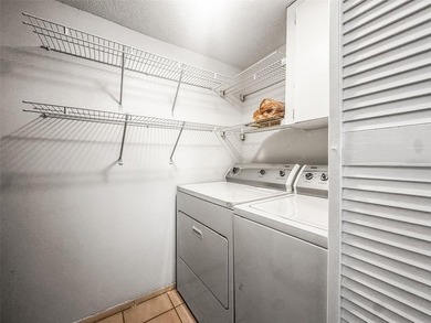 Beautifully updated condo offering modern comfort, effortless on East Bay Golf Club in Florida - for sale on GolfHomes.com, golf home, golf lot