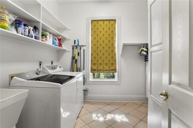 Exquisitely positioned on a desirable corner lot, this elegant on English Turn Golf and Country Club in Louisiana - for sale on GolfHomes.com, golf home, golf lot