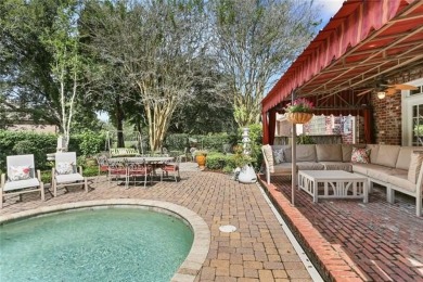 Exquisitely positioned on a desirable corner lot, this elegant on English Turn Golf and Country Club in Louisiana - for sale on GolfHomes.com, golf home, golf lot