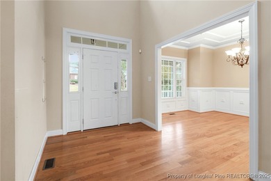 Nestled in a peaceful setting in Gates Four, this beautiful home on Gates Four Golf and Country Club in North Carolina - for sale on GolfHomes.com, golf home, golf lot