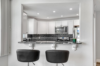 Enjoy waterfront living with wide water views from this freshly on North Palm Beach Country Club in Florida - for sale on GolfHomes.com, golf home, golf lot