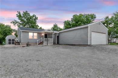 Welcome to your meticulously crafted retreat in the serene on Linn Valley Lakes - Deer Trace Golf Course in Kansas - for sale on GolfHomes.com, golf home, golf lot