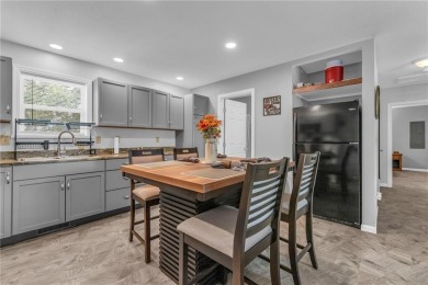 Welcome to your meticulously crafted retreat in the serene on Linn Valley Lakes - Deer Trace Golf Course in Kansas - for sale on GolfHomes.com, golf home, golf lot