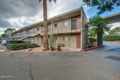 Lower end unit w/covered patio which opens up to green belt on Arizona Country Club in Arizona - for sale on GolfHomes.com, golf home, golf lot