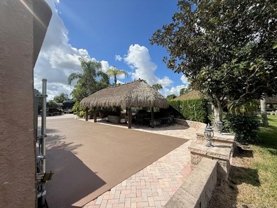 Exceptional Lot with Banyan Tree and Lake Views - Move-In Ready! on St. Lucie Trail Golf Club in Florida - for sale on GolfHomes.com, golf home, golf lot