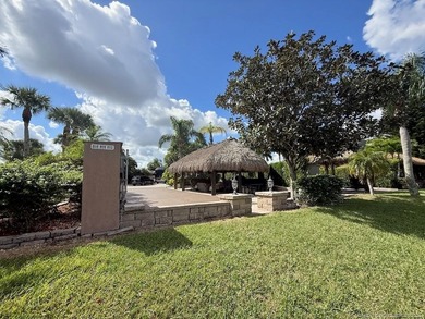 Exceptional Lot with Banyan Tree and Lake Views - Move-In Ready! on St. Lucie Trail Golf Club in Florida - for sale on GolfHomes.com, golf home, golf lot