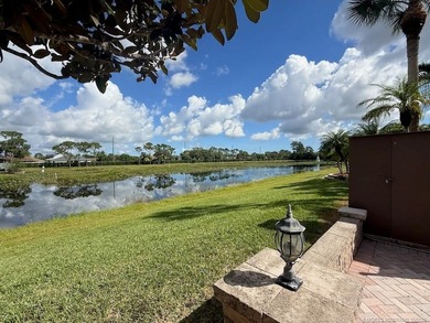Exceptional Lot with Banyan Tree and Lake Views - Move-In Ready! on St. Lucie Trail Golf Club in Florida - for sale on GolfHomes.com, golf home, golf lot