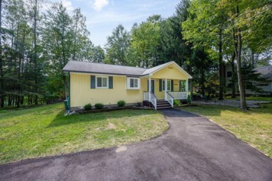 Discover the epitome of tranquility with this charming on Canadian Lakes Country Club-The Highlands Course in Michigan - for sale on GolfHomes.com, golf home, golf lot