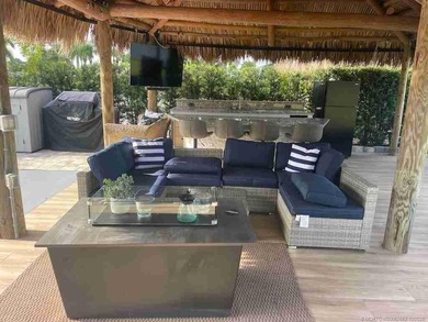 Prime Lakefront Lot with Golf Course Views - Fully Furnished! on Motorcoach Resort Golf Course in Florida - for sale on GolfHomes.com, golf home, golf lot