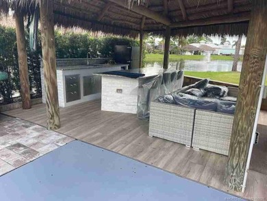 Prime Lakefront Lot with Golf Course Views - Fully Furnished! on Motorcoach Resort Golf Course in Florida - for sale on GolfHomes.com, golf home, golf lot