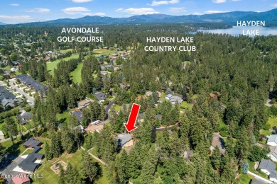 This beautifully updated 4 bed / 3 bath home sits on a spacious on Hayden Lake Country Club in Idaho - for sale on GolfHomes.com, golf home, golf lot