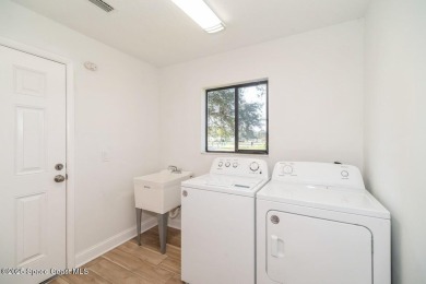 Step into this completely remodeled Washington model, nestled in on Indian River Colony Club in Florida - for sale on GolfHomes.com, golf home, golf lot