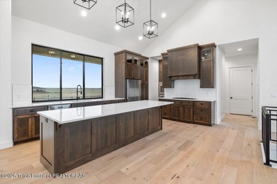 Discover elevated mountain living in this brand-new custom home on Teton Reserve in Idaho - for sale on GolfHomes.com, golf home, golf lot