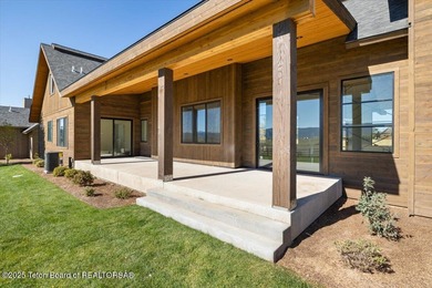 Discover elevated mountain living in this brand-new custom home on Teton Reserve in Idaho - for sale on GolfHomes.com, golf home, golf lot