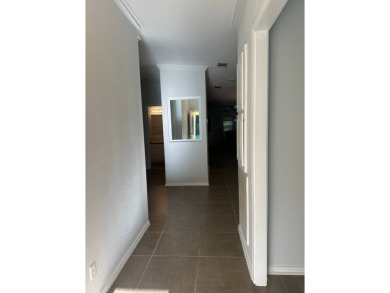 Rare Find! 2-Bedroom Palm Harbor Home with 2-Car Garage, Office on Schalamar Creek Golf and Country Club in Florida - for sale on GolfHomes.com, golf home, golf lot