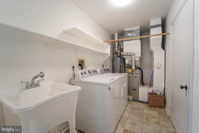 This charming brick and siding single-family home offers the on Heritage Harbour Golf Club in Maryland - for sale on GolfHomes.com, golf home, golf lot