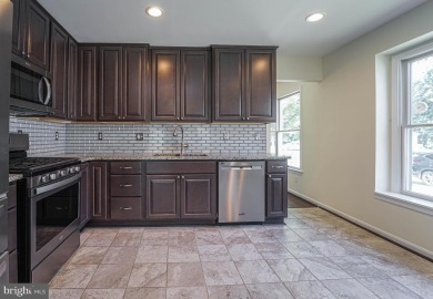 This charming brick and siding single-family home offers the on Heritage Harbour Golf Club in Maryland - for sale on GolfHomes.com, golf home, golf lot