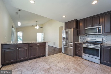 This charming brick and siding single-family home offers the on Heritage Harbour Golf Club in Maryland - for sale on GolfHomes.com, golf home, golf lot