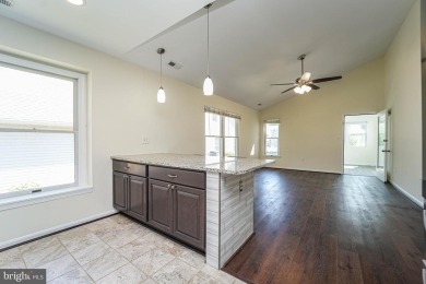 This charming brick and siding single-family home offers the on Heritage Harbour Golf Club in Maryland - for sale on GolfHomes.com, golf home, golf lot