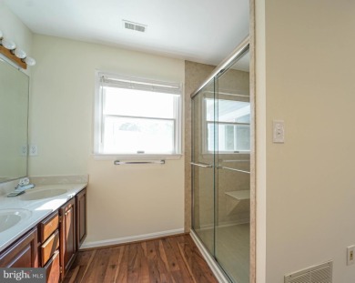 This charming brick and siding single-family home offers the on Heritage Harbour Golf Club in Maryland - for sale on GolfHomes.com, golf home, golf lot