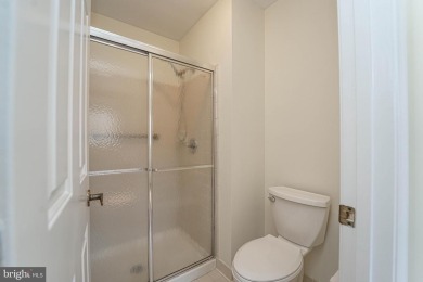 This charming brick and siding single-family home offers the on Heritage Harbour Golf Club in Maryland - for sale on GolfHomes.com, golf home, golf lot