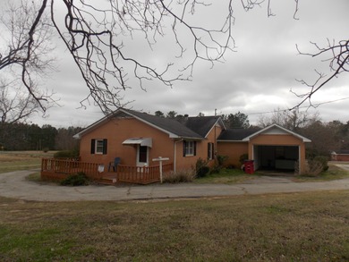 OVER 14 ACRES IN A GREAT LOCATION WITH A VERY NICE UPDATED BRICK on Rocky Branch Golf Club in Georgia - for sale on GolfHomes.com, golf home, golf lot