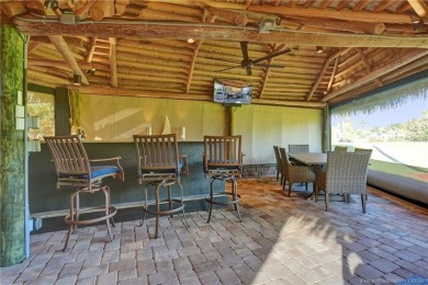 Turnkey RV Lot with Premium Tiki and Lake Views! Enjoy on Motorcoach Resort Golf Course in Florida - for sale on GolfHomes.com, golf home, golf lot