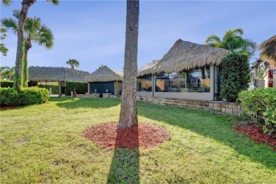 Turnkey RV Lot with Premium Tiki and Lake Views! Enjoy on Motorcoach Resort Golf Course in Florida - for sale on GolfHomes.com, golf home, golf lot