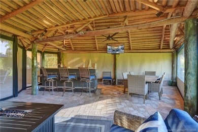 Turnkey RV Lot with Premium Tiki and Lake Views! Enjoy on Motorcoach Resort Golf Course in Florida - for sale on GolfHomes.com, golf home, golf lot