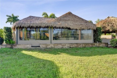 Turnkey RV Lot with Premium Tiki and Lake Views! Enjoy on Motorcoach Resort Golf Course in Florida - for sale on GolfHomes.com, golf home, golf lot