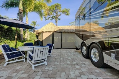 Turnkey RV Lot with Premium Tiki and Lake Views! Enjoy on Motorcoach Resort Golf Course in Florida - for sale on GolfHomes.com, golf home, golf lot