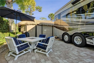 Turnkey RV Lot with Premium Tiki and Lake Views! Enjoy on Motorcoach Resort Golf Course in Florida - for sale on GolfHomes.com, golf home, golf lot