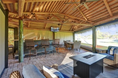 Turnkey RV Lot with Premium Tiki and Lake Views! Enjoy on Motorcoach Resort Golf Course in Florida - for sale on GolfHomes.com, golf home, golf lot