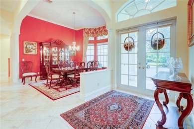 Luxury lakeside living awaits in this 5-bedroom, 3 full and 2 on Willoughby Golf Club in Florida - for sale on GolfHomes.com, golf home, golf lot