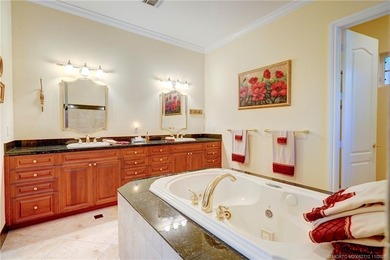 Luxury lakeside living awaits in this 5-bedroom, 3 full and 2 on Willoughby Golf Club in Florida - for sale on GolfHomes.com, golf home, golf lot