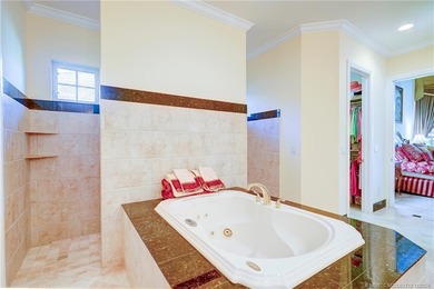 Luxury lakeside living awaits in this 5-bedroom, 3 full and 2 on Willoughby Golf Club in Florida - for sale on GolfHomes.com, golf home, golf lot