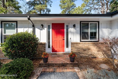 This beautiful brick ranch is tucked away in The Woodlands on Country Club of North Carolina in North Carolina - for sale on GolfHomes.com, golf home, golf lot