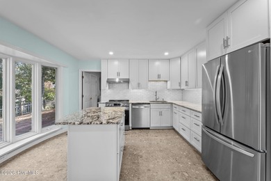 This beautiful brick ranch is tucked away in The Woodlands on Country Club of North Carolina in North Carolina - for sale on GolfHomes.com, golf home, golf lot