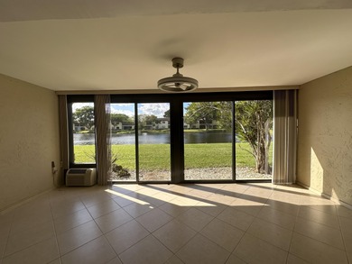 Welcome to this light and bright 2BR/2.5BA lakefront townhouse on Boca Lago Golf and Country Club in Florida - for sale on GolfHomes.com, golf home, golf lot