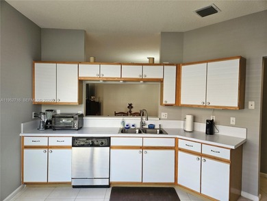 Lovely 3BR/2BA/2CG villa in the gated community of Summerfield on Champions Club at Summerfield in Florida - for sale on GolfHomes.com, golf home, golf lot