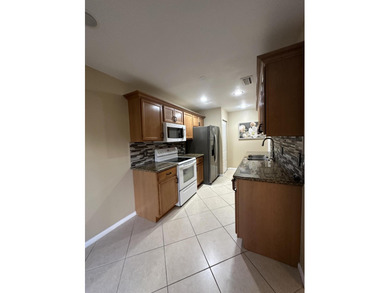 Welcome to this light and bright 2BR/2.5BA lakefront townhouse on Boca Lago Golf and Country Club in Florida - for sale on GolfHomes.com, golf home, golf lot