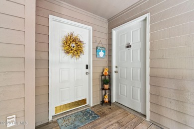 Discover your perfect retreat in this beautifully appointed on Oyster Bay Golf Links in North Carolina - for sale on GolfHomes.com, golf home, golf lot