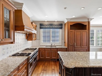 This exquisite French Country-inspired residence is situated on Forest Lake Country Club in Michigan - for sale on GolfHomes.com, golf home, golf lot