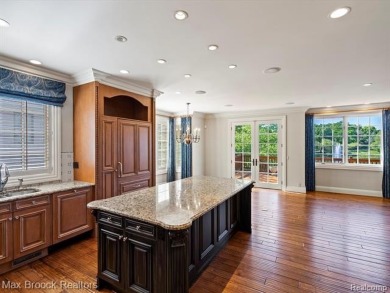 This exquisite French Country-inspired residence is situated on Forest Lake Country Club in Michigan - for sale on GolfHomes.com, golf home, golf lot