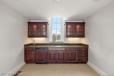 This exquisite French Country-inspired residence is situated on Forest Lake Country Club in Michigan - for sale on GolfHomes.com, golf home, golf lot