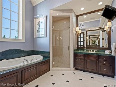 This exquisite French Country-inspired residence is situated on Forest Lake Country Club in Michigan - for sale on GolfHomes.com, golf home, golf lot